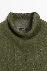 Draped high neck knit top