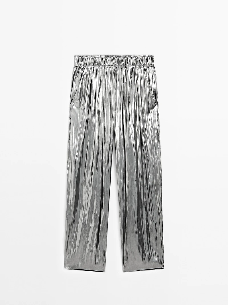 Flowing metallic trousers with gathered detail