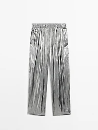 Flowing metallic trousers with gathered detail