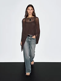 Cape en maille coupe asymétrique