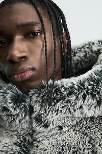 BLOUSON EFFET FOURRURE À CAPUCHE