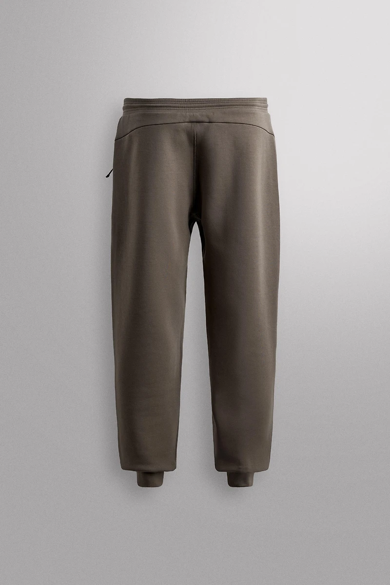 TECHNICAL ZIP PANTS