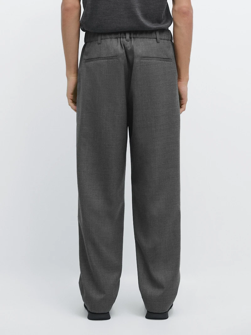 Pantalon relaxed fit à pinces en laine froide