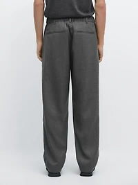 Pantalon relaxed fit à pinces en laine froide