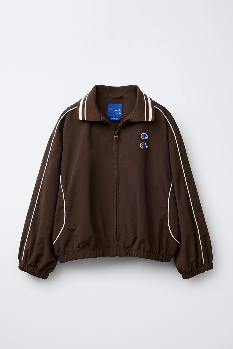BLOUSON NYLON AVEC SAC CHAMPION ® X ZARA