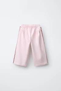 PANTALON À PINCES CŒURS