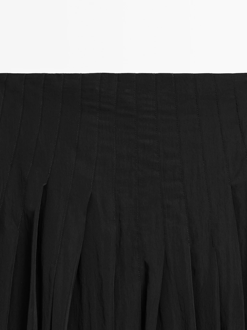 Flowing midi skirt with box pleats