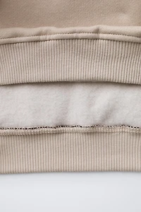 SWEAT À CAPUCHE COLOR BLOCK ET INSCRIPTION