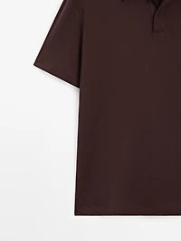 Short sleeve polo shirt with snap-button placket