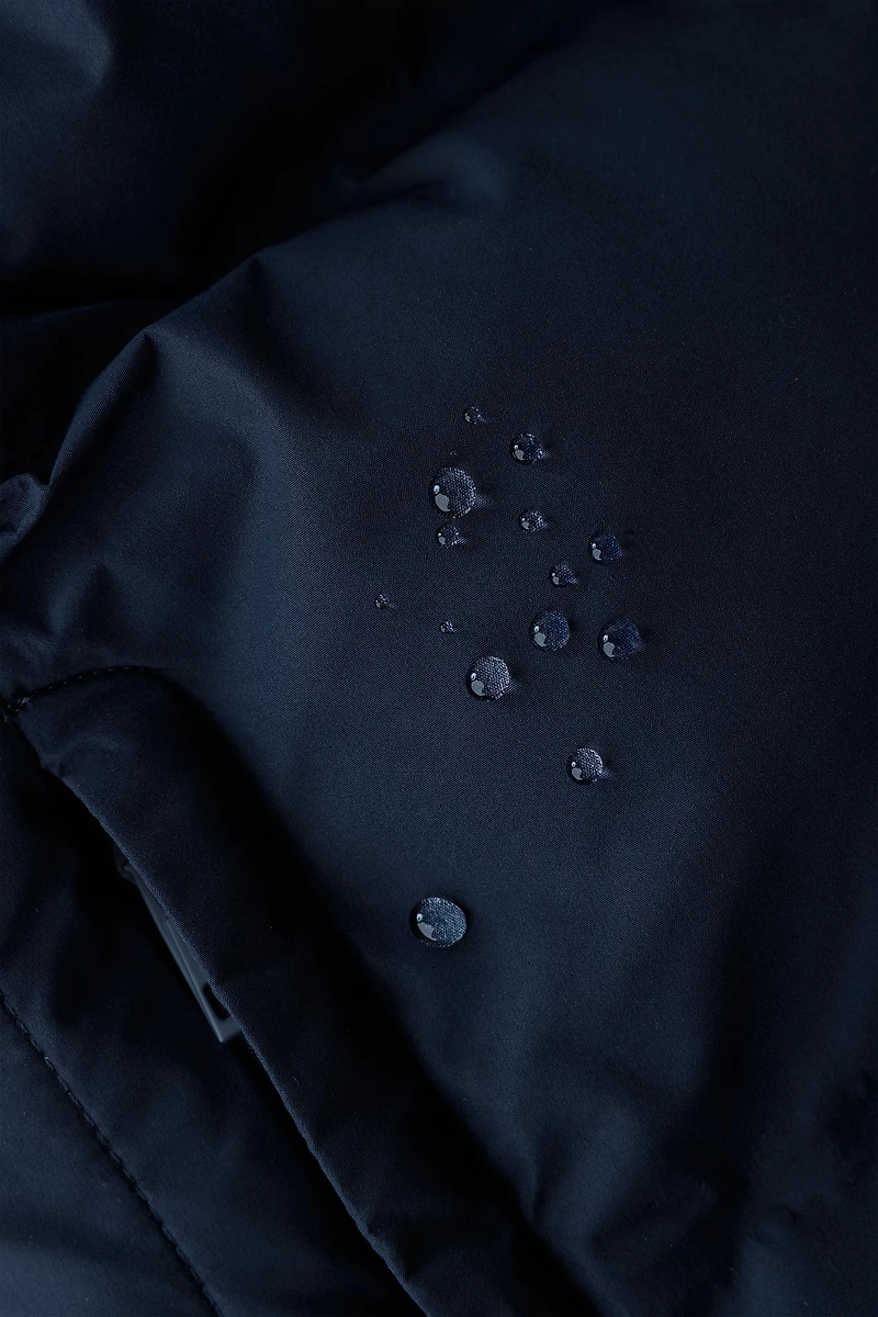 BLOUSON MATELASSÉ À CAPUCHE DÉPERLANT