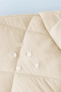 WATER REPELLENT NYLON FAUX SHEARLING JACKET