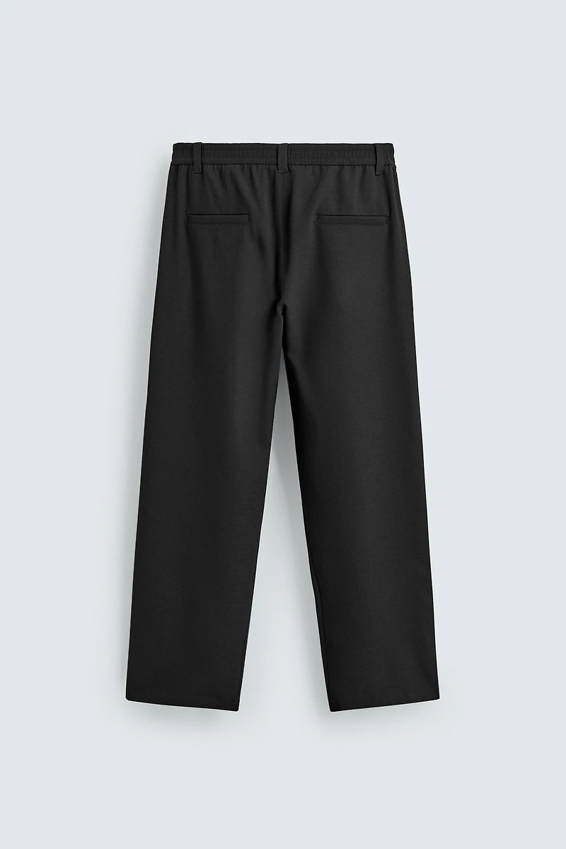 RELAXED FIT PLEATED PANTS