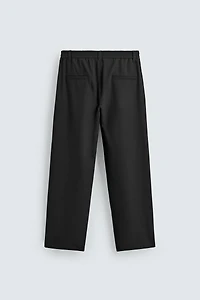 RELAXED FIT PLEATED PANTS
