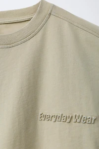 WASHED EFFECT EMBOSSED TEXT T-SHIRT
