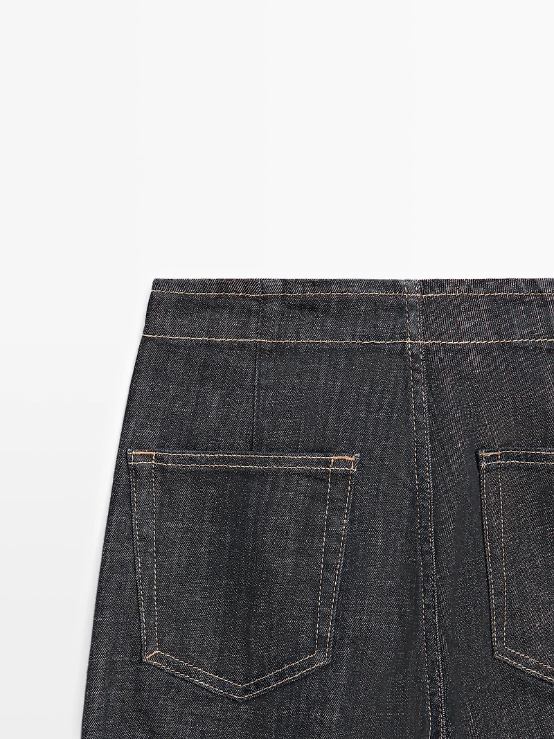 High-waist wide-leg jeans with chains