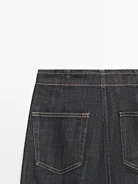 High-waist wide-leg jeans with chains