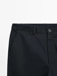 Slim fit trousers with elastic side detail