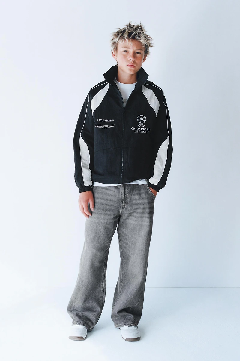 UEFA CHAMPIONS LEAGUE ® WATER REPELLENT JACKET WITH HOODIE
