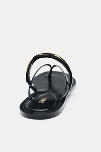 SANDALS WITH METALLIC APPLIQUÉ