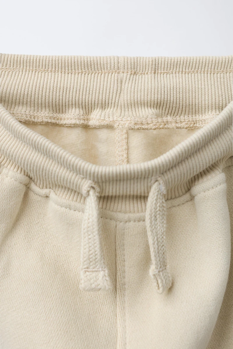 FLOCKED LOGO JOGGER PANTS