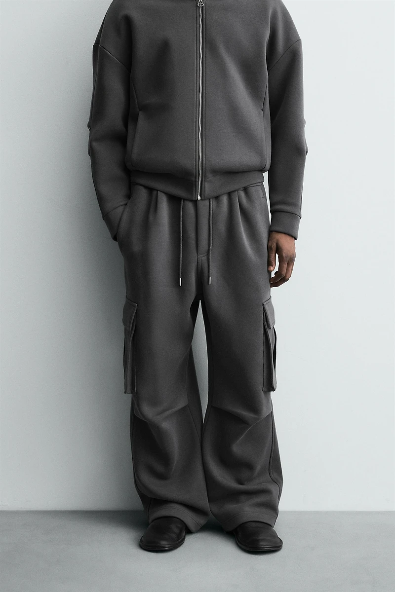 NEOPRENE EFFECT CARGO PANTS WITH PLEATS