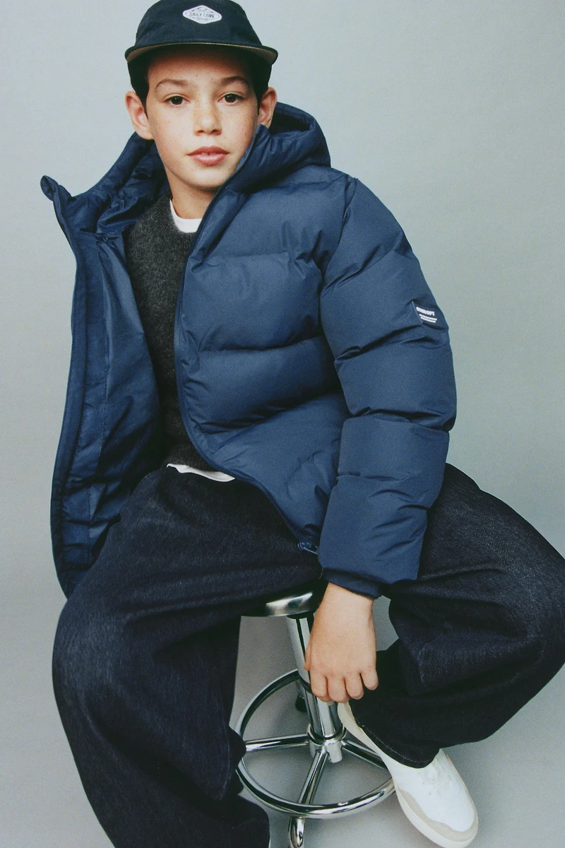 MANTEAU REMBOURRÉ ÉTIQUETTE DÉPERLANT