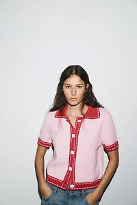 VESTE EN MAILLE SURPIQÛRES MANCHES COURTES