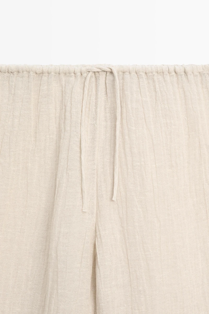 Total look flowing waffle-knit linen blend trousers