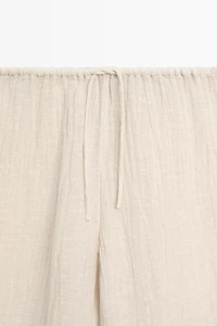 Total look flowing waffle-knit linen blend trousers