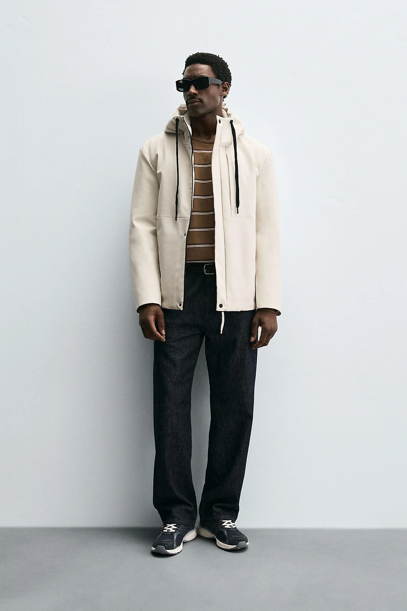 VESTE TECHNIQUE À CAPUCHE