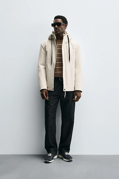 VESTE TECHNIQUE À CAPUCHE