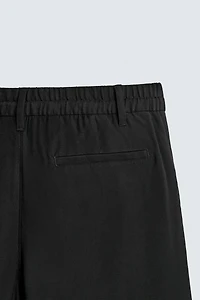 FLOWY RELAXED FIT PLEATED PANTS