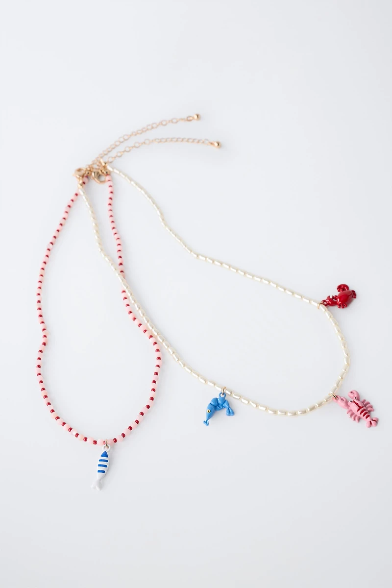 PACK OF TWO PEARL AND SEA BEAD NECKLACES