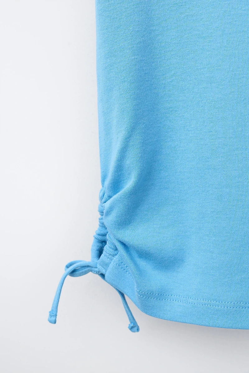 MODAL T-SHIRT WITH CUT OUTS AND BOWS