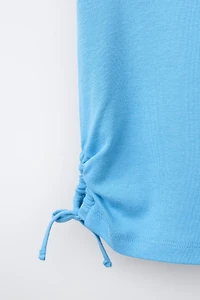 MODAL T-SHIRT WITH CUT OUTS AND BOWS
