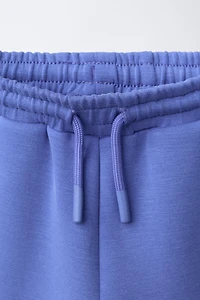 SHORT EN INTERLOCK À ÉTIQUETTE