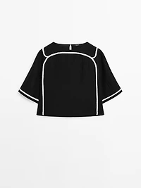 Blouse avec broderie contrastante