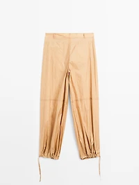 Lightweight trousers with strap details - Studio