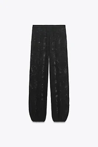 PANTALON EN MAILLE TEXTURÉE À FLEURS
