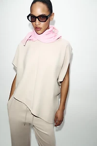 ASYMMETRIC INTERLOCK CAPE