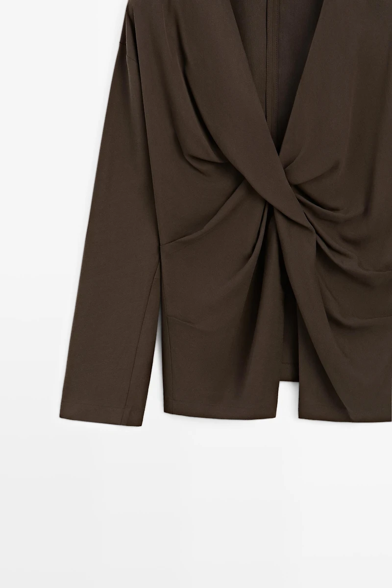 Flowing blouse with draped detail