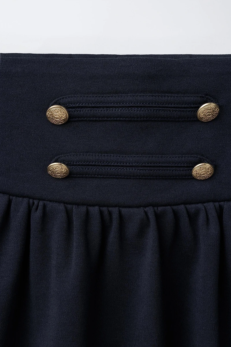 FROG FASTENING AND BUTTON SKIRT