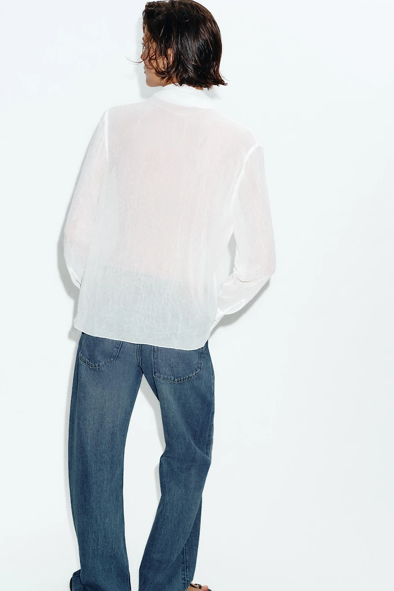 BLOUSE SEMI-TRANSPARENTE FLEUR
