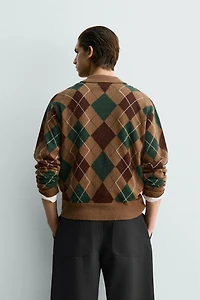 POLO EN MAILLE À LOSANGES 100 % LAINE