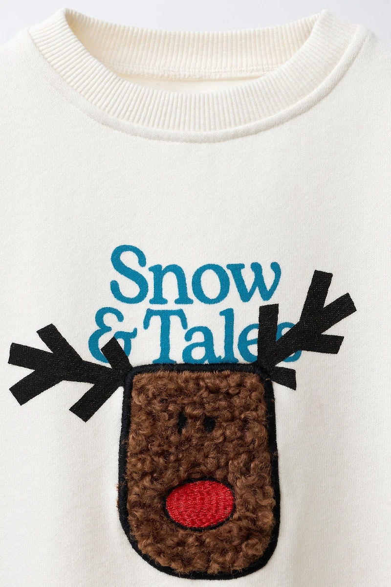 FAUX SHEARLING REINDEER PATCH SWEATSHIRT