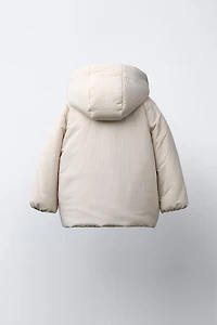 WATER REPELLENT PUFFER COAT WITH BOWS