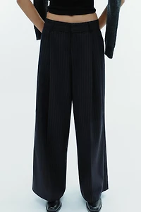 PINSTRIPE PANTS WITH PLEATS AND FLAPS