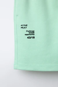 ATHLETIC SHORTS WITH RAISED TEXT