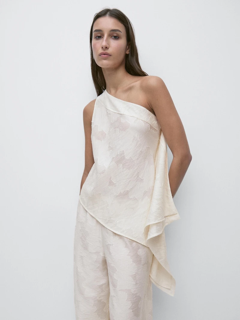 Top with asymmetric neckline