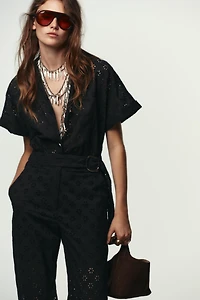 EMBROIDERED EYELET BUCKLE JUMPSUIT